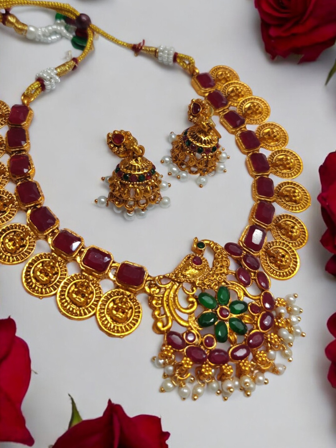 

OOMPH Gold-Plated Stone Studded & Beaded Peacock Design Necklace and Earrings, Maroon