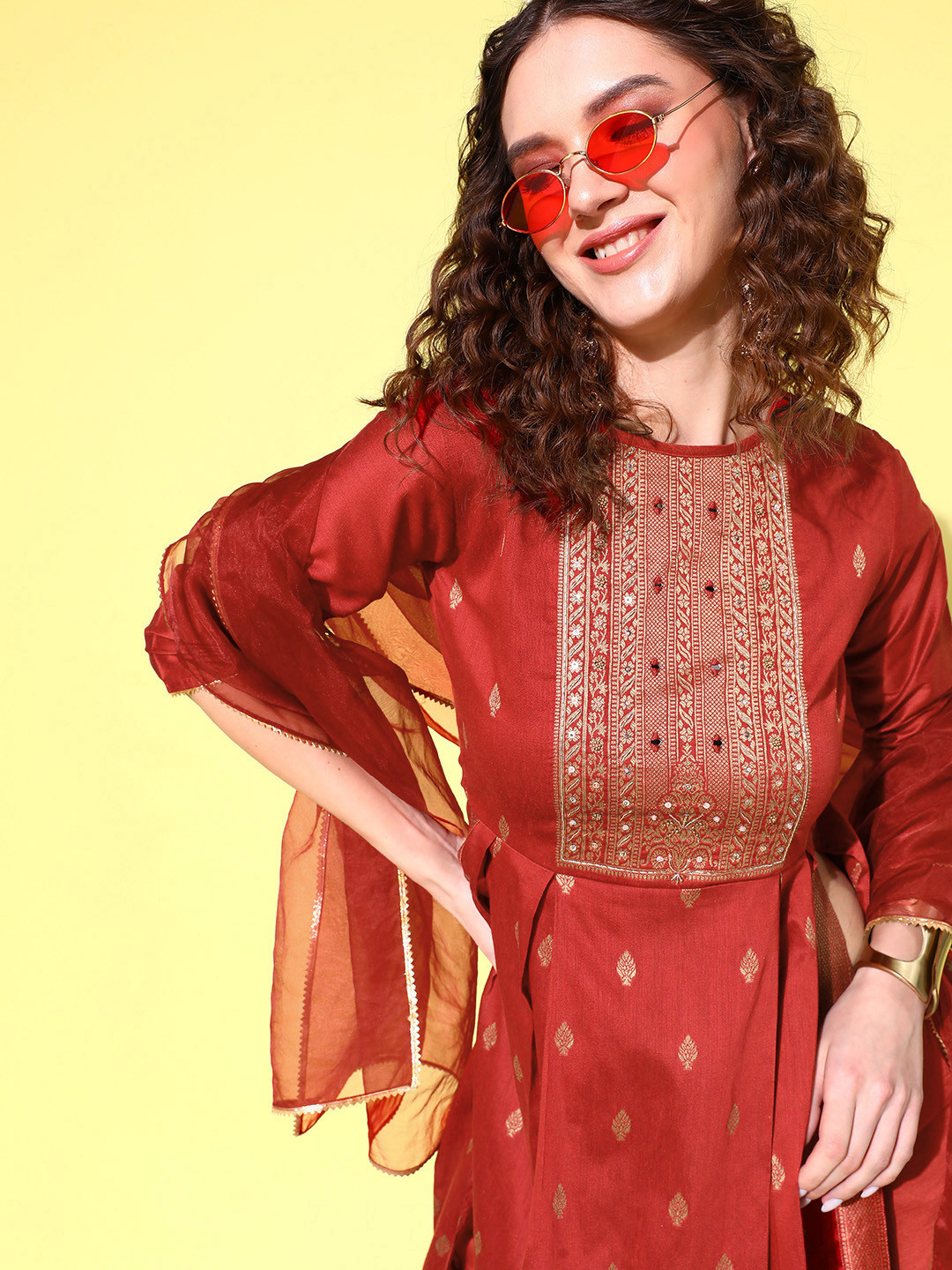 

Sangria Ethnic Motifs Yoke Design Pleated Chanderi Silk Kurta with Trousers & Dupatta, Rust
