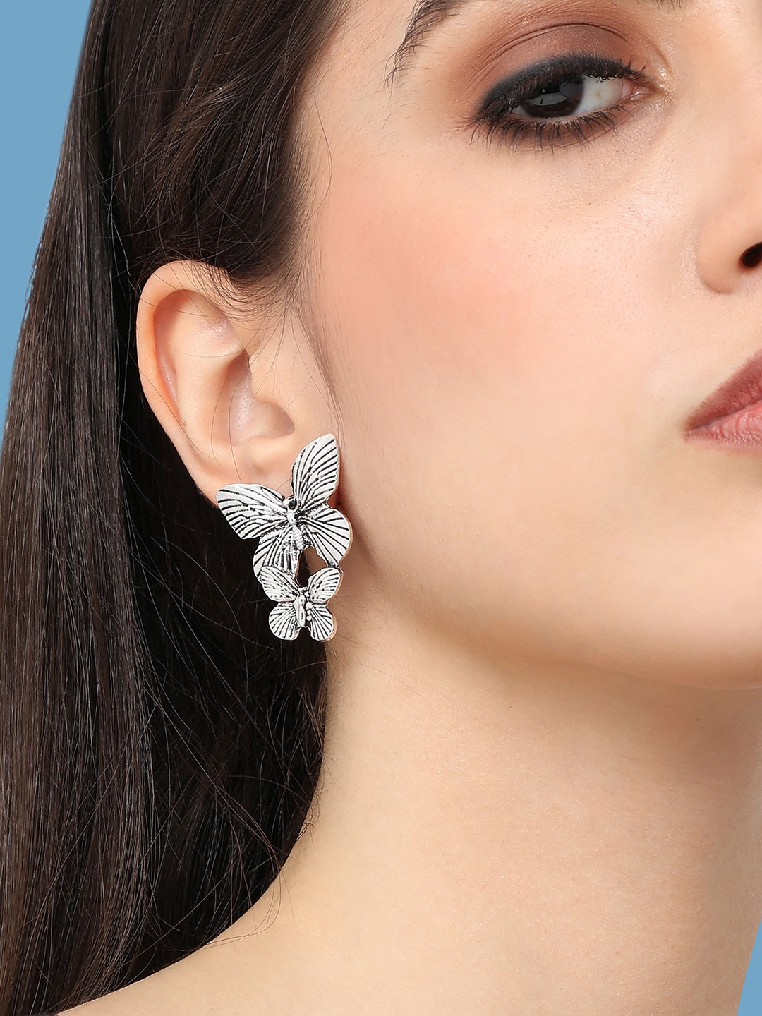 

SOHI Silver-Plated Contemporary Drop Earrings
