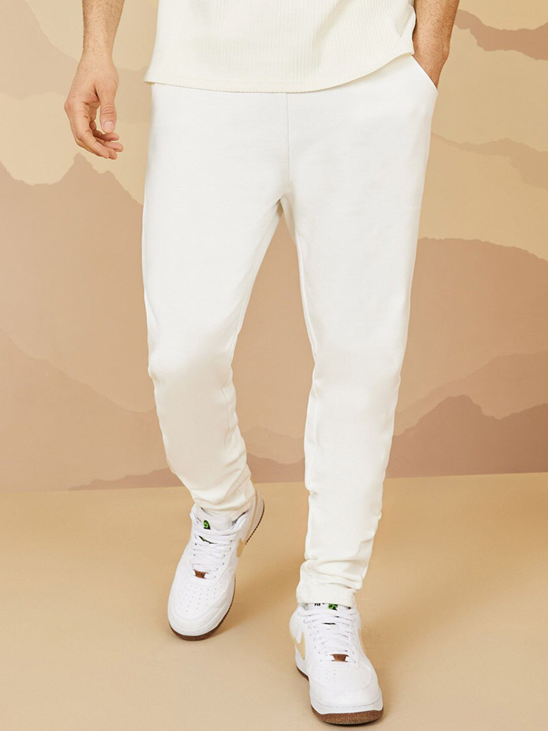 

Styli Men Solid Relaxed Fit Mid-Rise Pure Cotton Knitted Track Pants, Cream