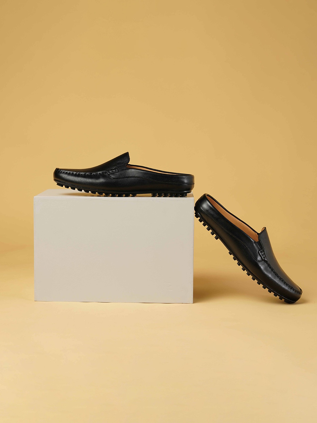 

Ruosh Men Textured Leather Loafers, Black