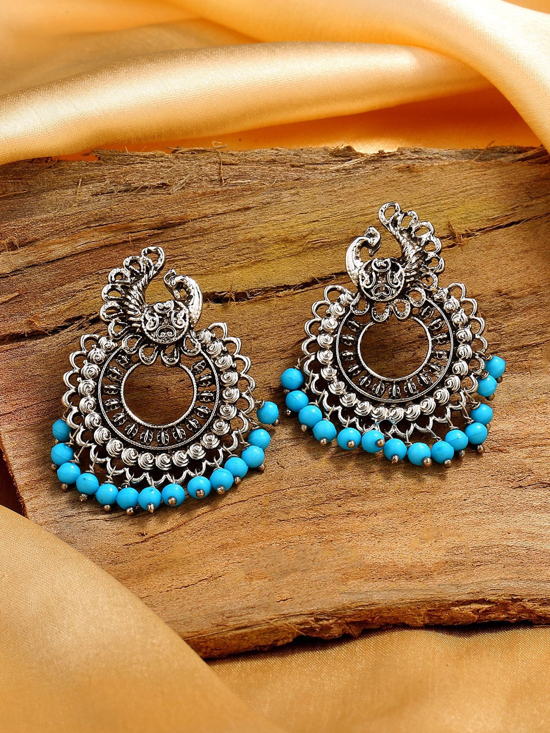 

Estele Rhodium-Plated Peacock Shaped Chandbalis Earrings, Blue