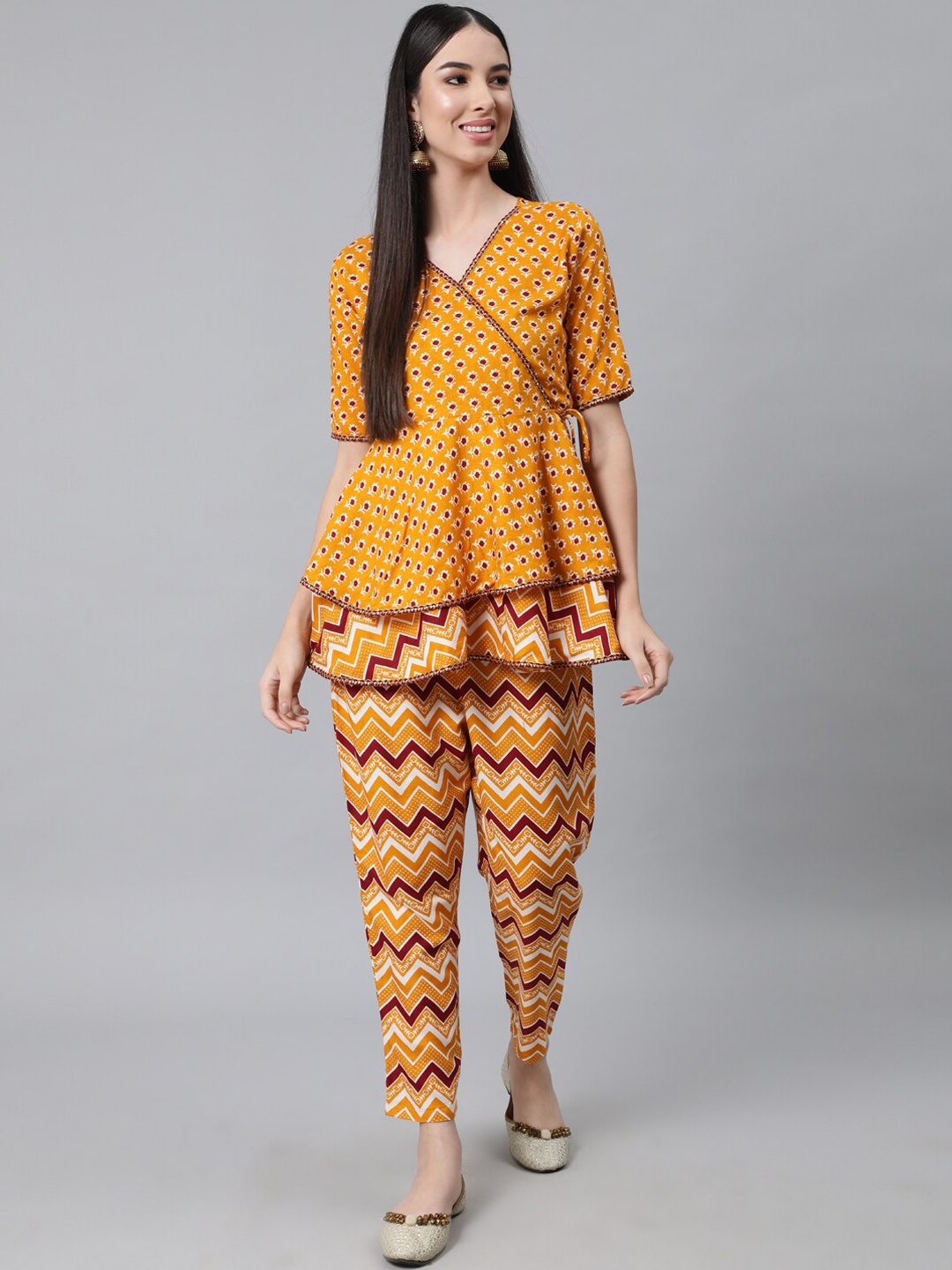 

Anubhutee Floral Printed Angrakha Pure Cotton Kurti with Trousers, Mustard