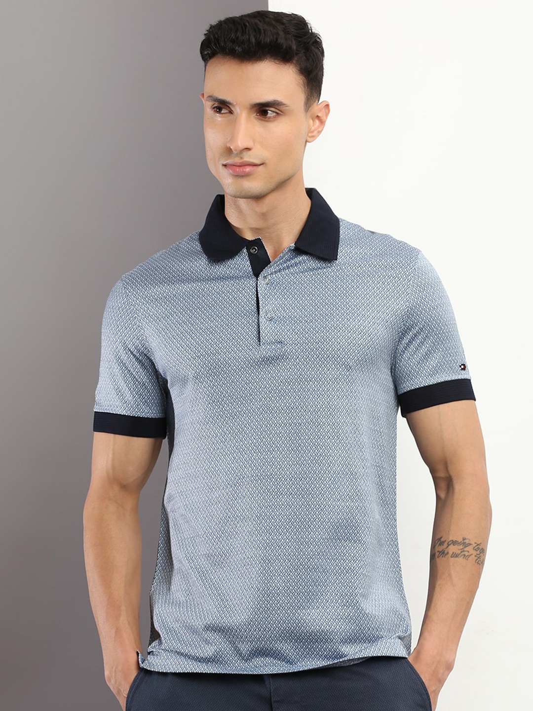 

Tommy Hilfiger Men Abstract Printed Cotton Polo Collar Slim Fit T-shirt, Blue