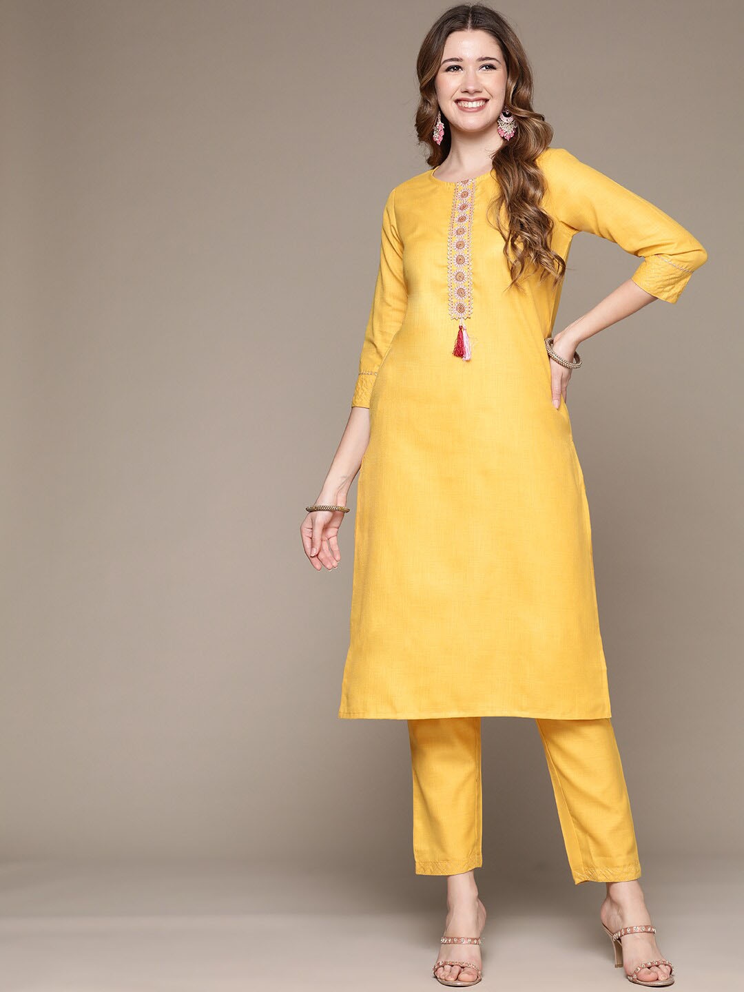 

Anubhutee Embroidered Round Neck Calf Length Straight Kurta with Trousers, Yellow