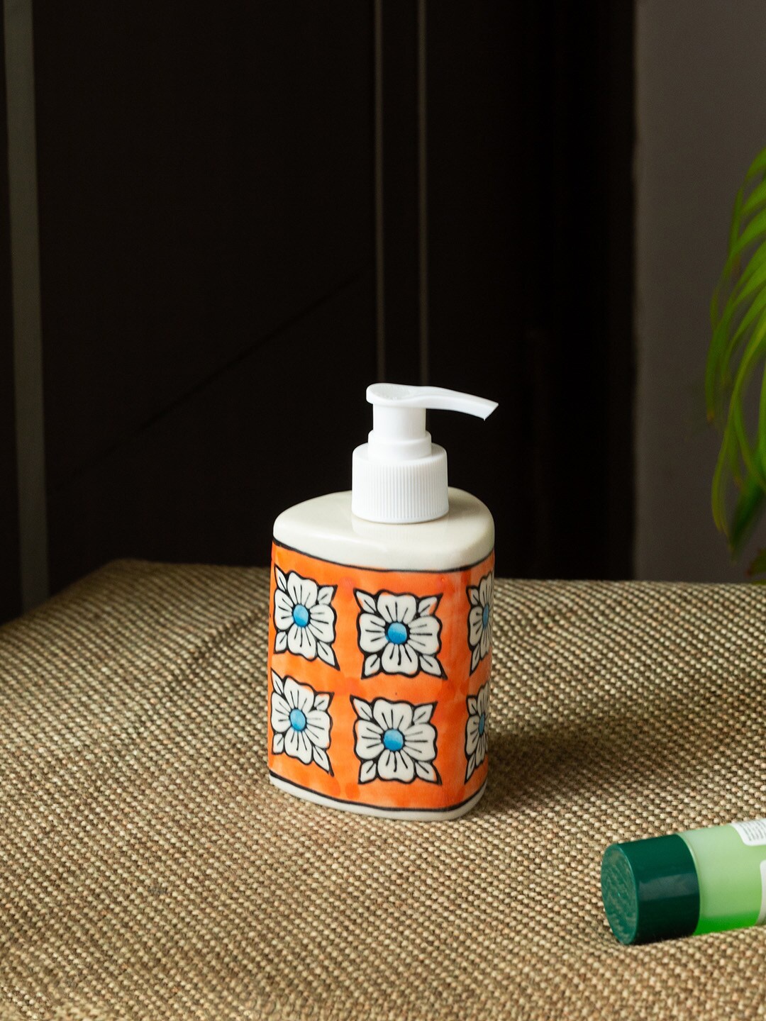 

ExclusiveLane Marigold Bloom White & Orange-Colored Printed Ceramic Soap Dispenser 260 ml