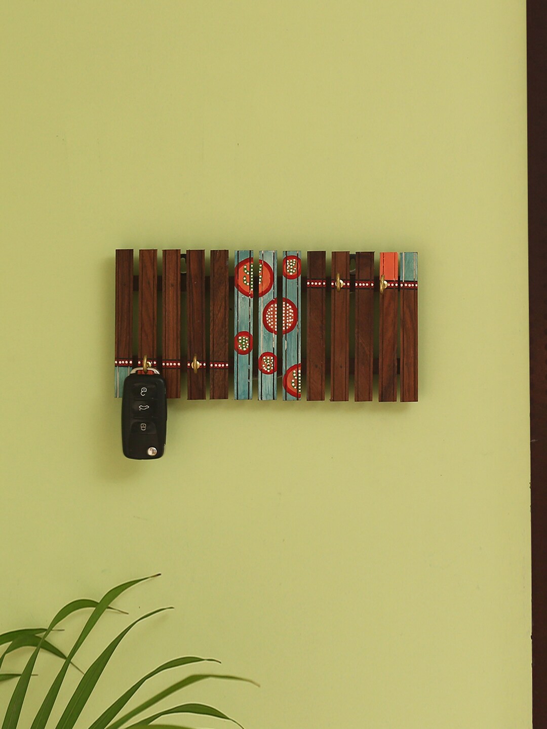 

ExclusiveLane Brown & Turquoise-Blue Printed Wooden Wall Hanging Key Holder