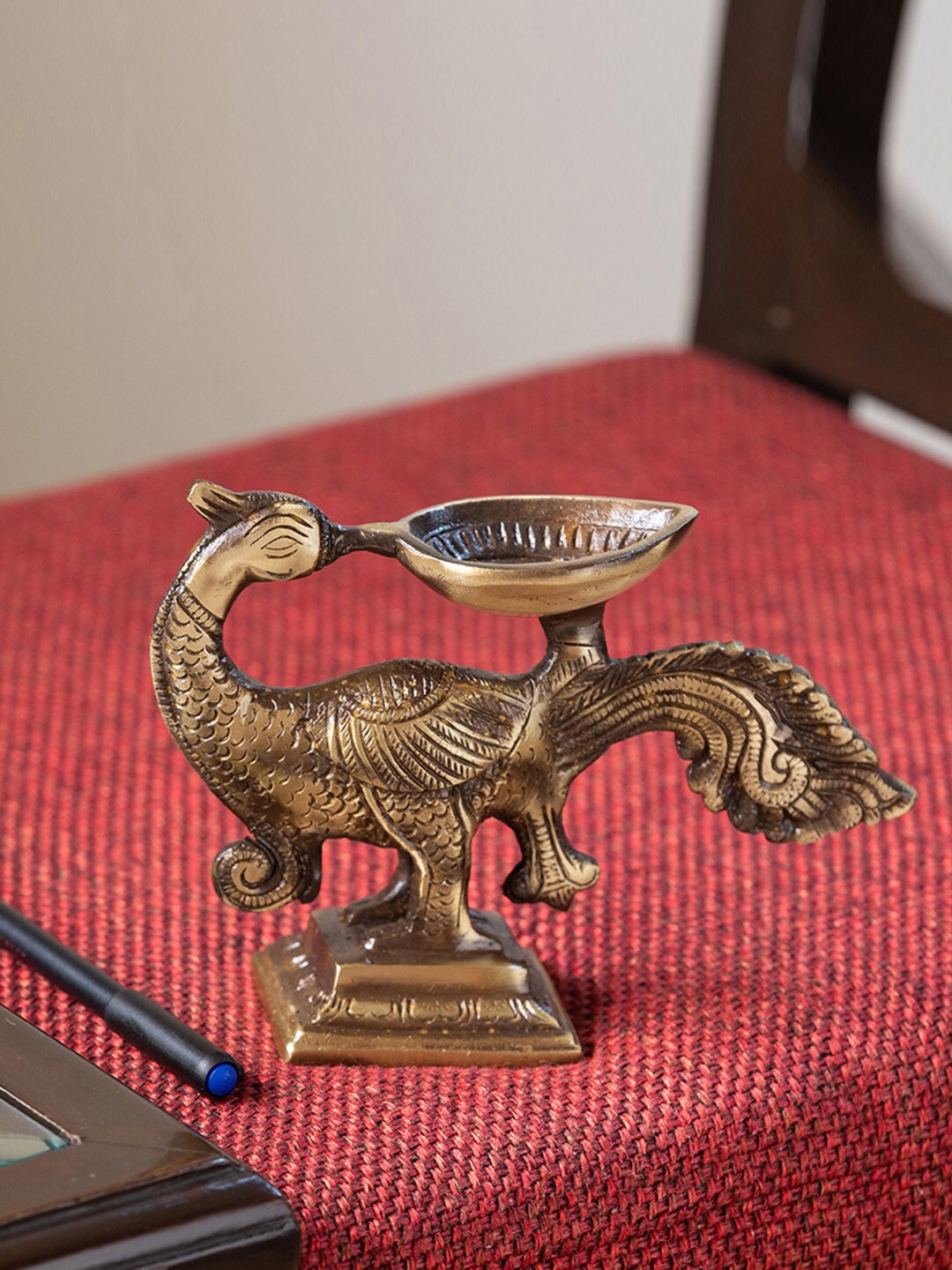 

ExclusiveLane The Brass Beams Gold-Toned Textured Glowing Peacock Shaped Diya