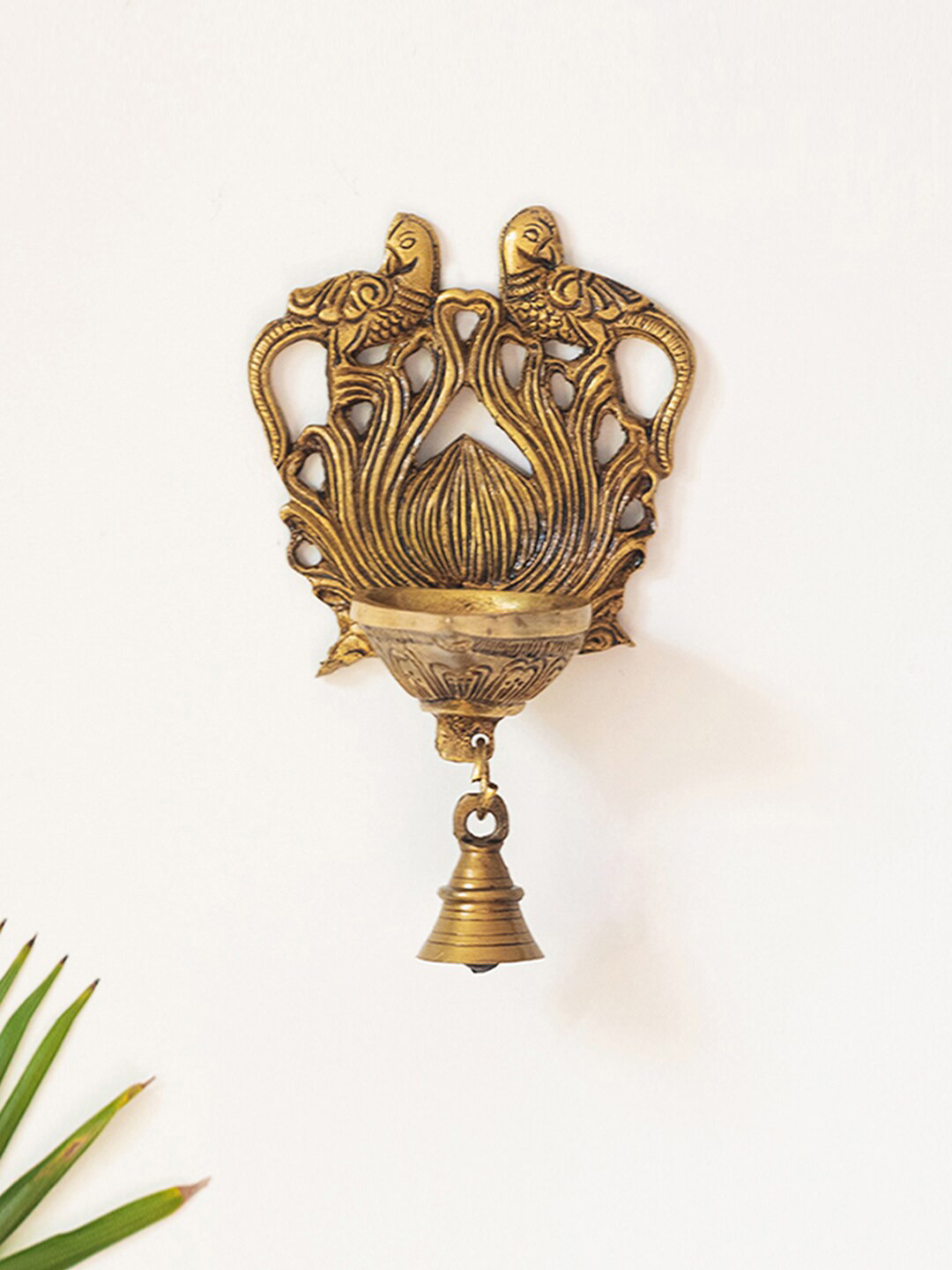 

ExclusiveLane Gold-toned Textured Hand-Etched Wall Hanging Peacock Diya With Bell
