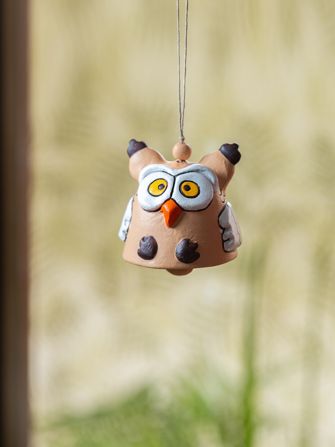 

ExclusiveLane Harmonious Hymns Beige & Black Hoots Wall Hanging