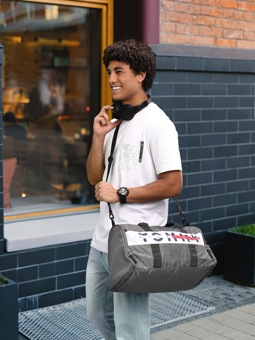

Tommy Hilfiger Unisex Brand Logo Printed Duffel Bag, Grey