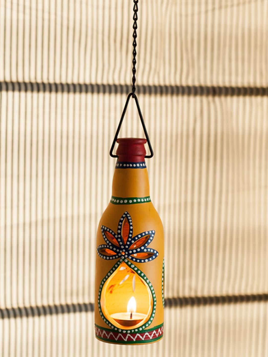 

ExclusiveLane Yellow Printed Bottle Shaped Hanging Cum Table Tea Light Holder