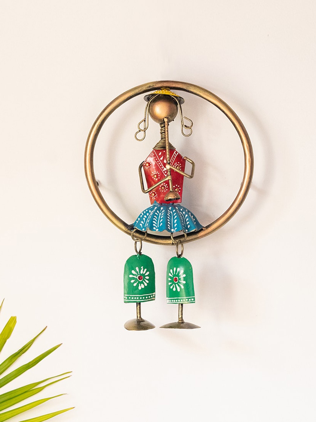 

ExclusiveLane Songs Of The Homeland Gold-Toned & Red Printed Rajasthani Bansuri Folk Musician Hanging Wall Decor