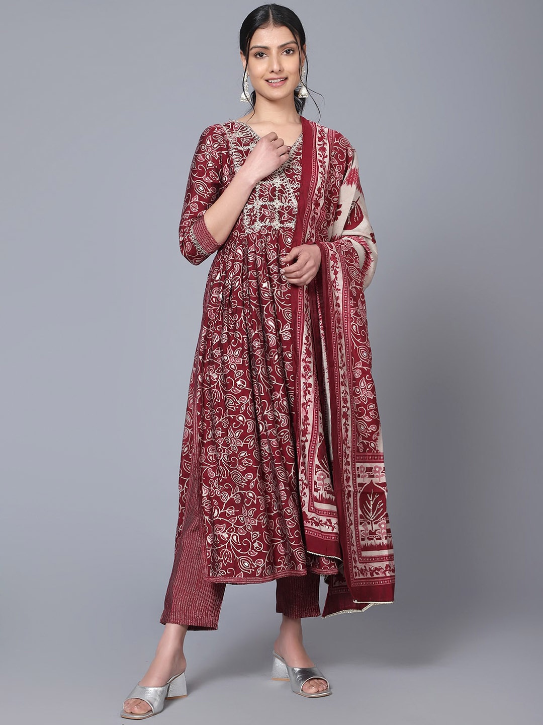 

Bani Women Ethnic Motifs Printed Pleated Thread Work A-Line Kurta With Trousers & Dupatta, Maroon