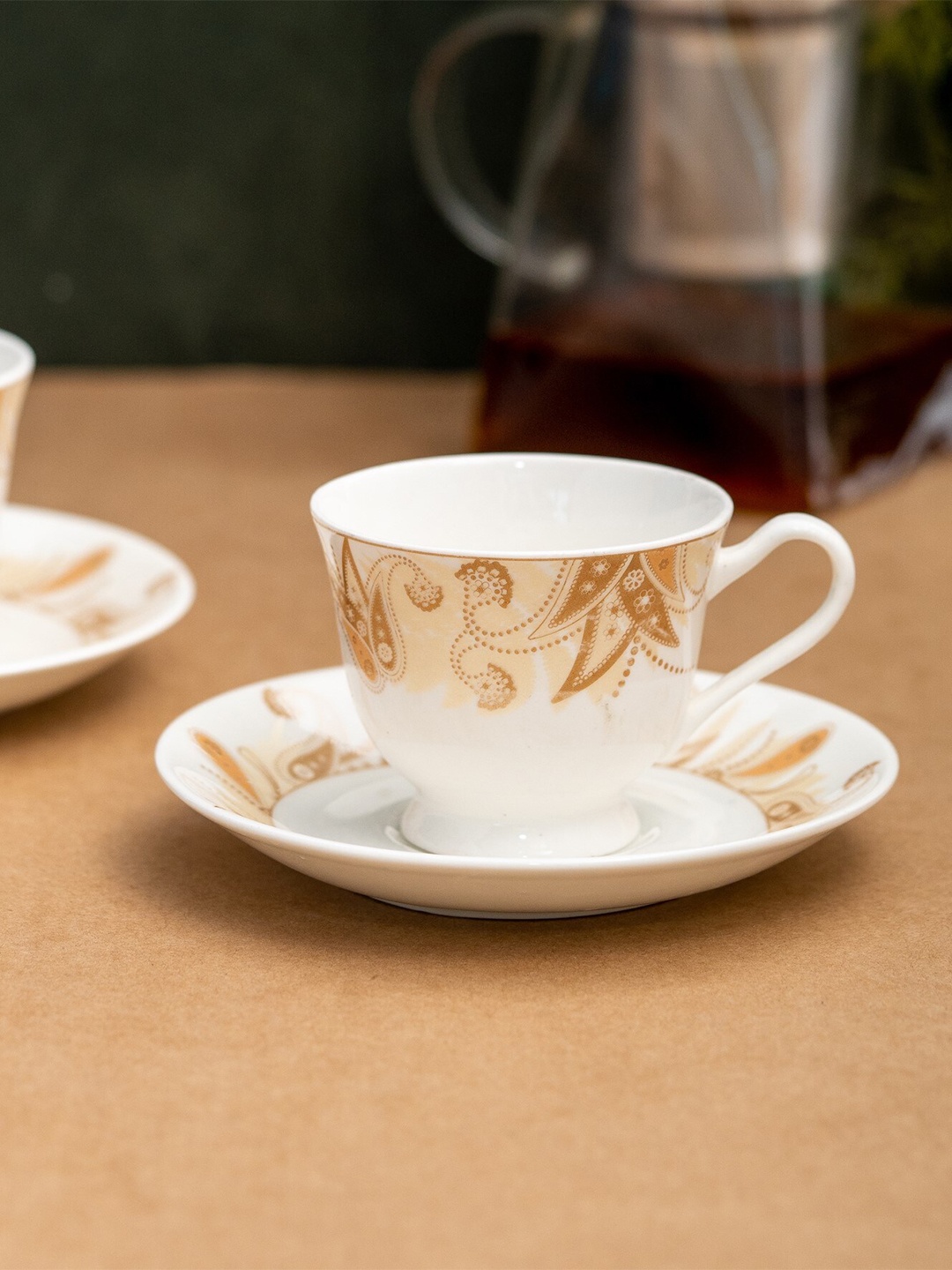 

CLAY CRAFT White & Brown 12 Pcs Ethnic Motifs Printed Ceramic Cups and Saucers 180 ml each