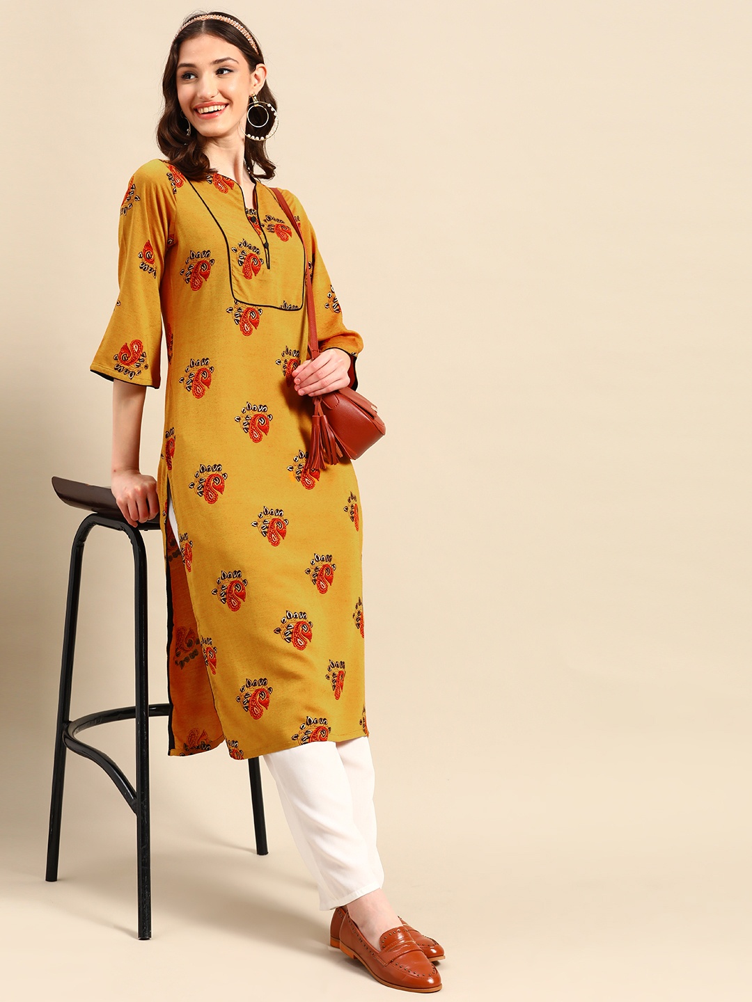 

Sangria Ethnic Motifs Printed Bell Sleeves Kurta, Mustard