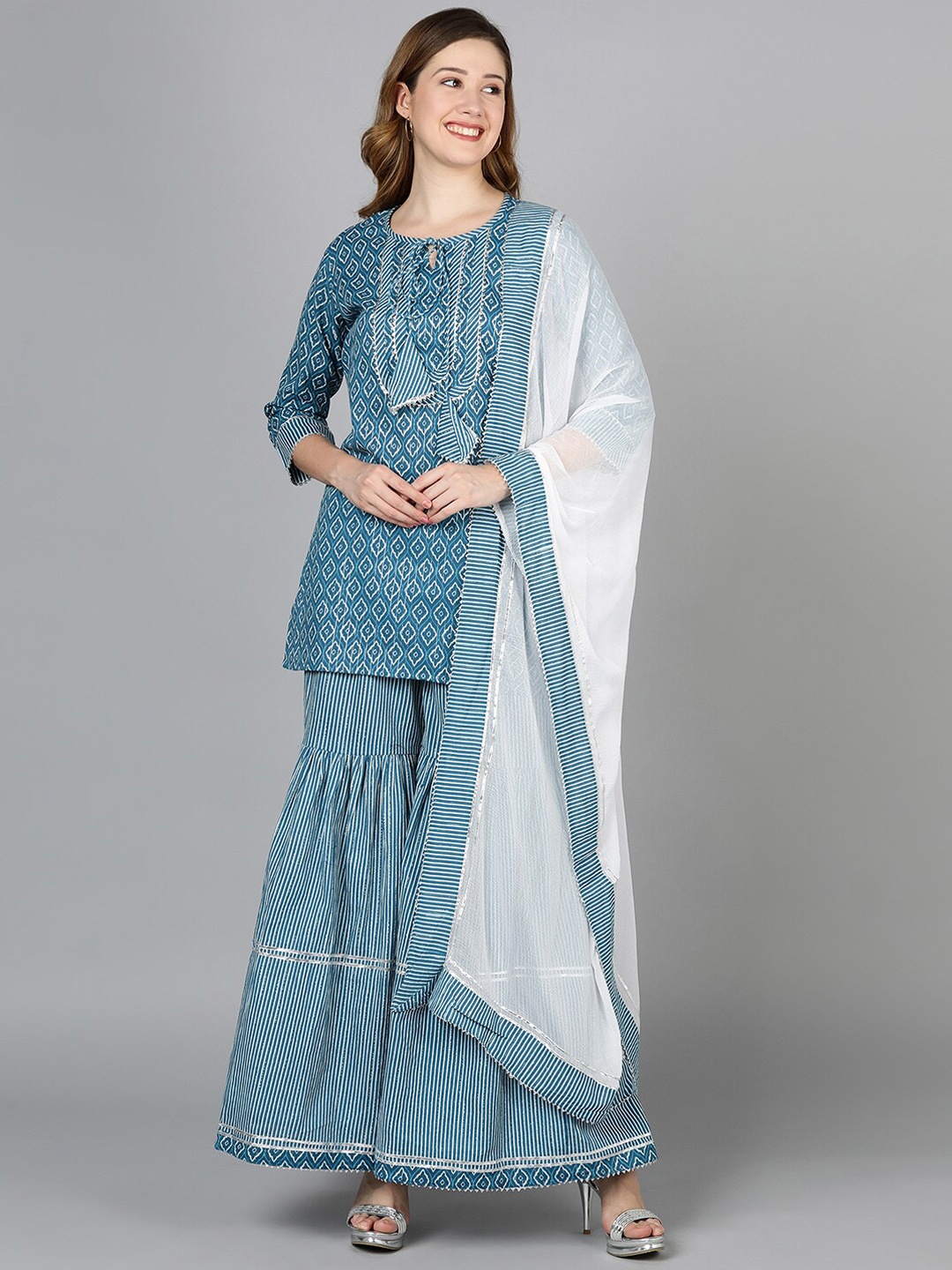 

Senyora Printed Pure Cotton Tie-Up Neck Straight Kurta with Sharara & With Dupatta, Blue