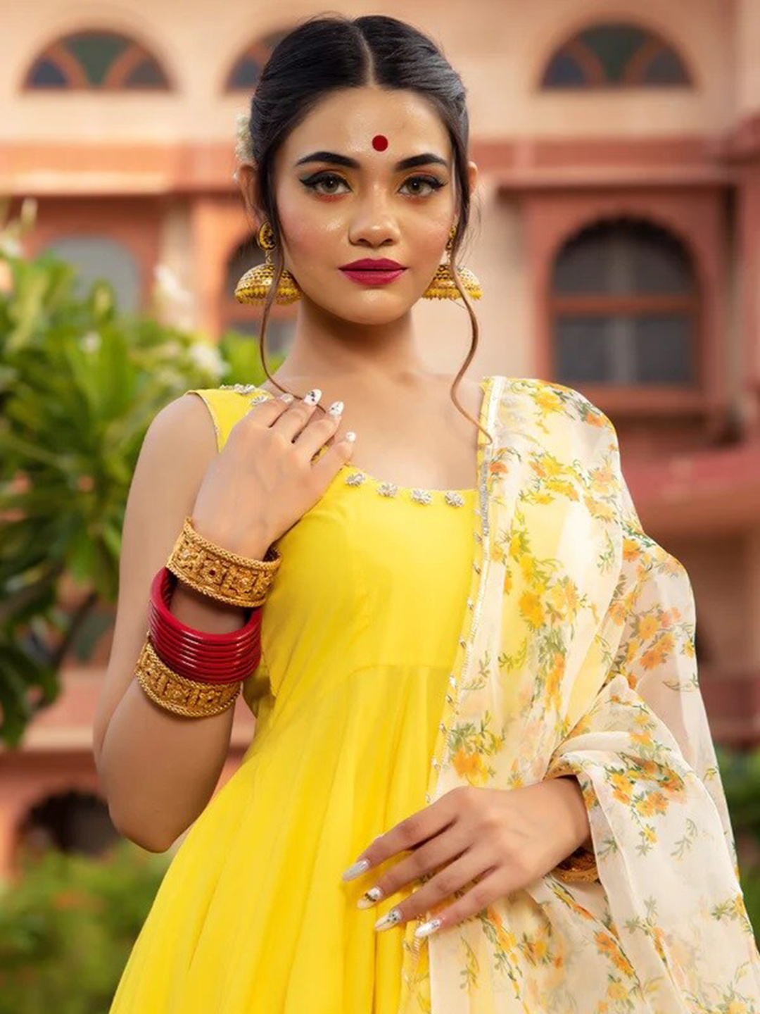 

Pomcha Women Yellow Floral Kurta with Trousers & With Dupatta