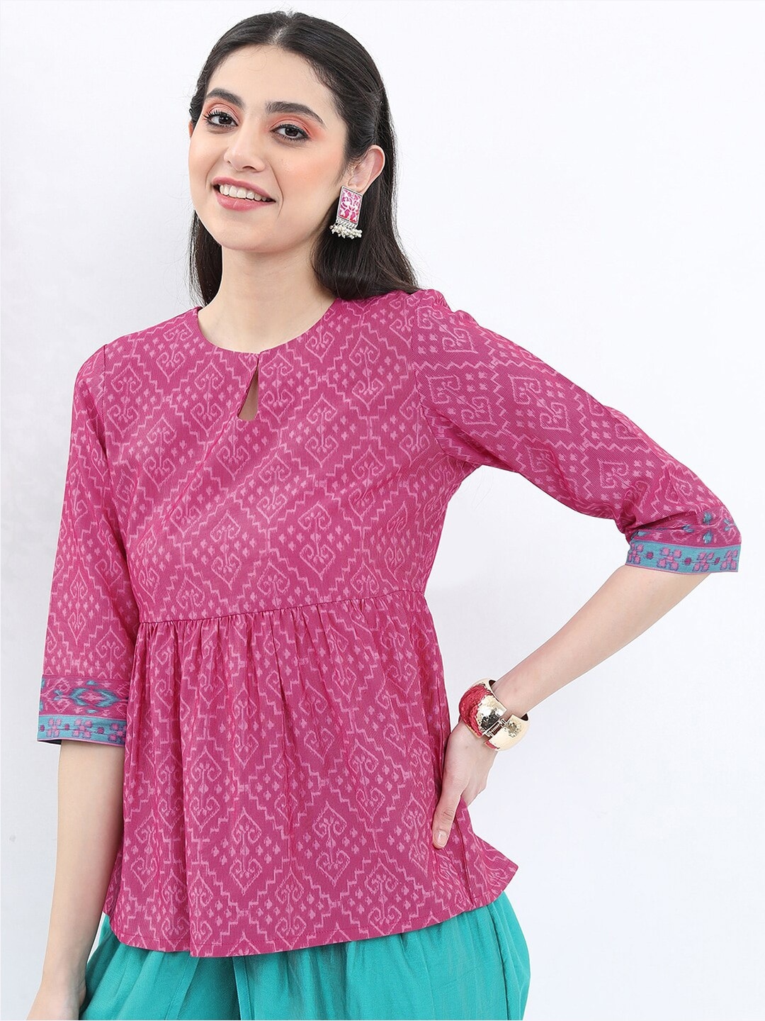 

Vishudh Ethnic Printed Keyhole Neck Pleated A-Line Top, Magenta