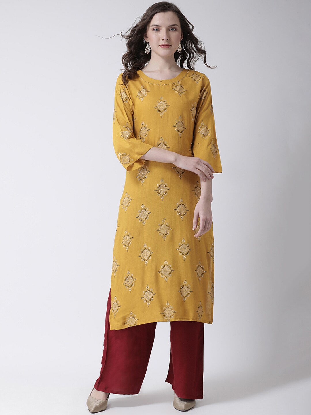 

Charitra Round Neck Ethnic Motifs Printed Beads and Stones Kurta With Palazzos, Mustard