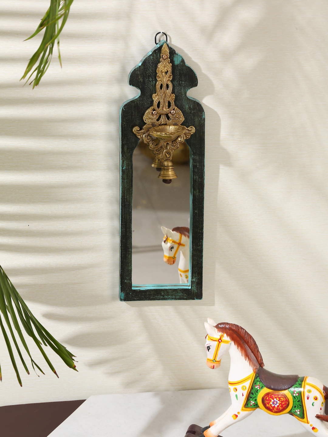 

Amoliconcepts Green Distress Finish Mirror with Brass Bell Diya, Multi