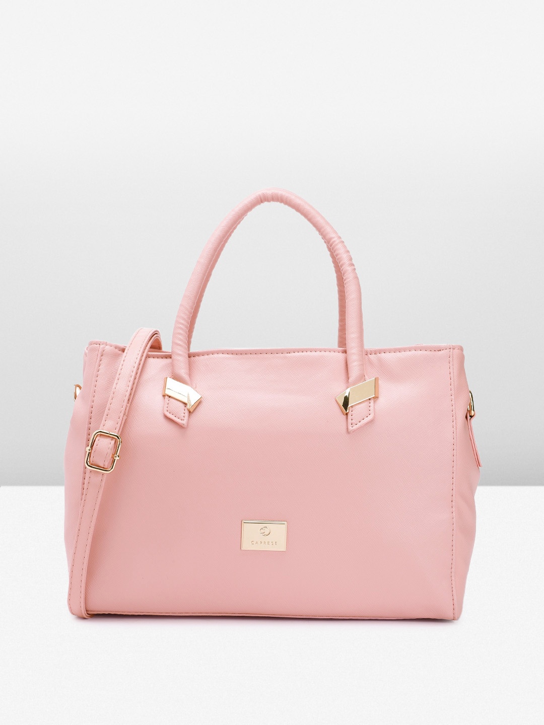 

Caprese Solid Regular Structured Handheld Bag, Pink