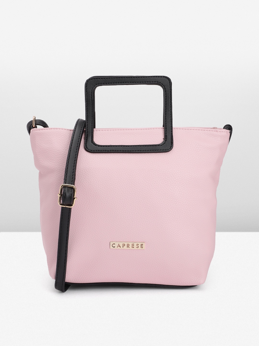 

Caprese Women Solid Handheld Bag, Pink