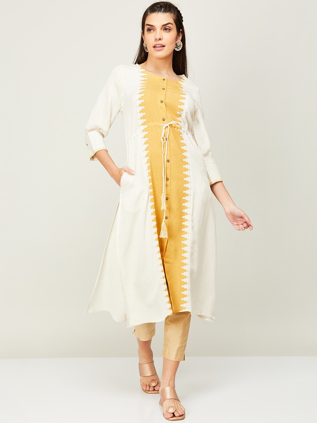 

Melange by Lifestyle Women Colourblocked Round Neck A-Line Kurta, Yellow