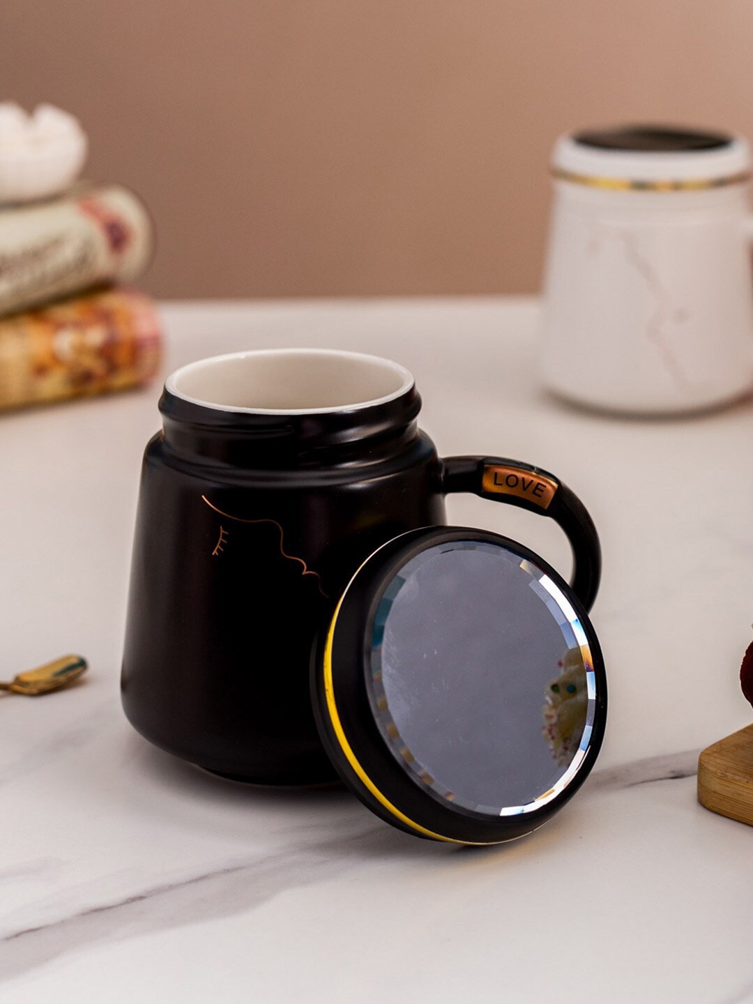 

THEDECORKART Black & Gold-Toned 2 Pcs Printed Ceramic Mug with Lid 100 ml