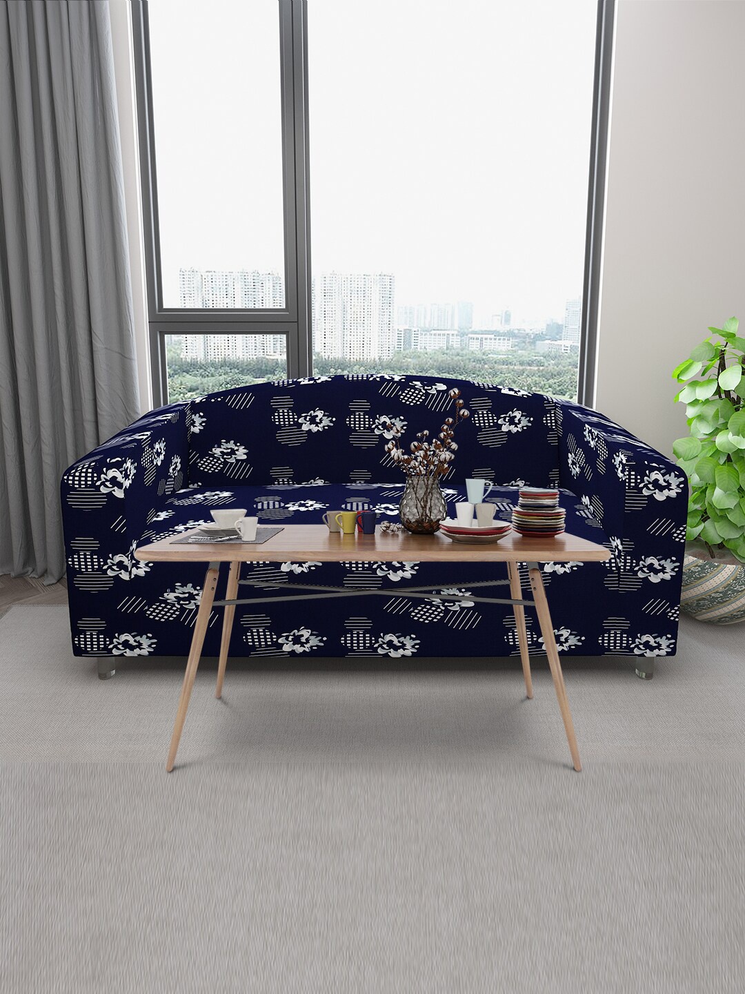 

DREAM CARE Navy Blue & White Floral Printed Stretchable 3-Seater Sofa Cover With Anti Slip Foam Sticks