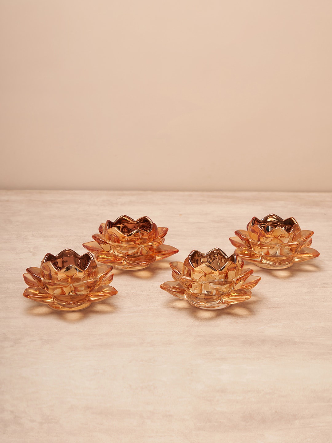 

Pure Home and Living Brown 4 Pcs Lotus Shaped Glass Tealight Holders