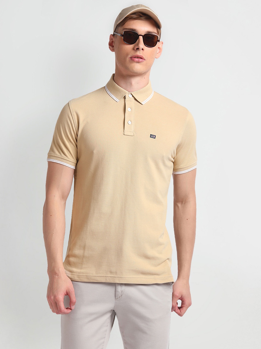 

Arrow Sport Pure Cotton Striped Collar Solid Polo Shirt, Beige