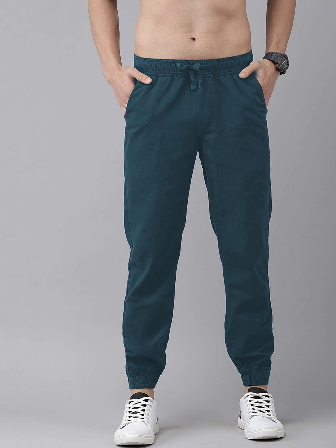 

The Roadster Lifestyle Co. Men Solid Mid Rise Slim Fit Joggers, Blue
