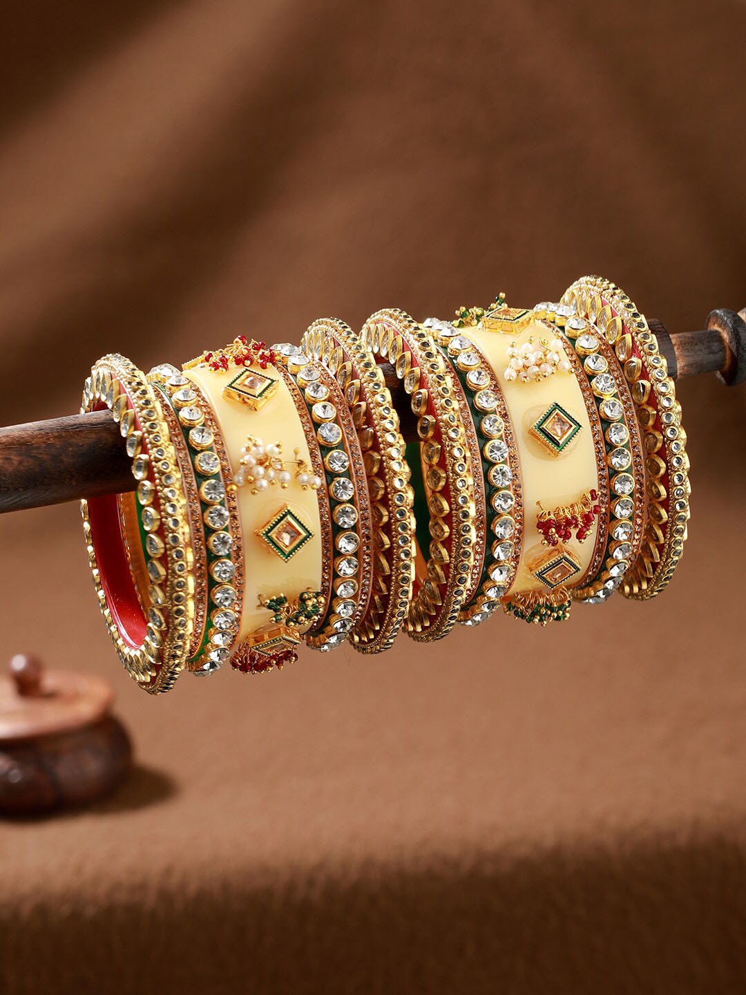 

Jazz and Sizzle Set Of 18 Gold Plated Stones & Beads-Studded Bangle Set
