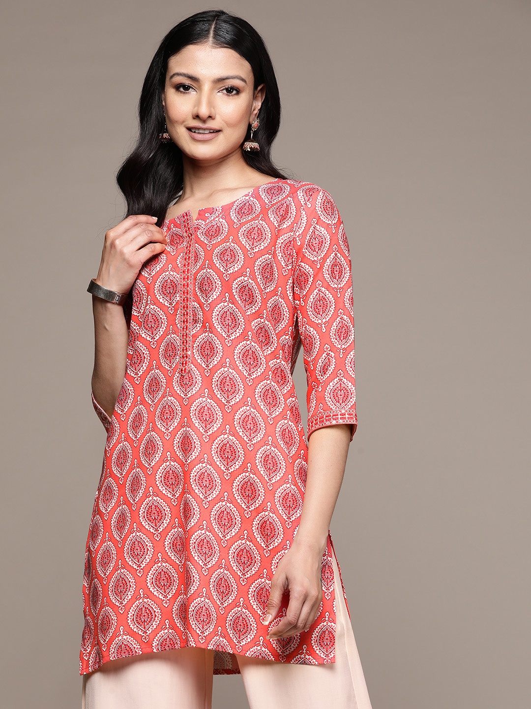 

Anubhutee Ethnic Motifs Printed Sequinned Kurti, Peach