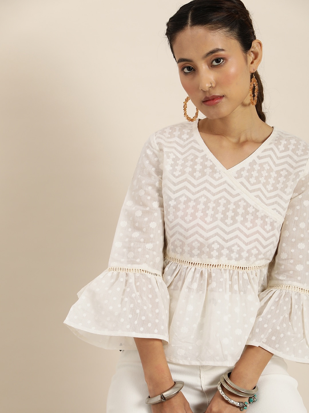 

Taavi Cora Floral & Polka Dots Self Design V-Neck Bell Sleeves Lace Inserts Peplum Top, Off white