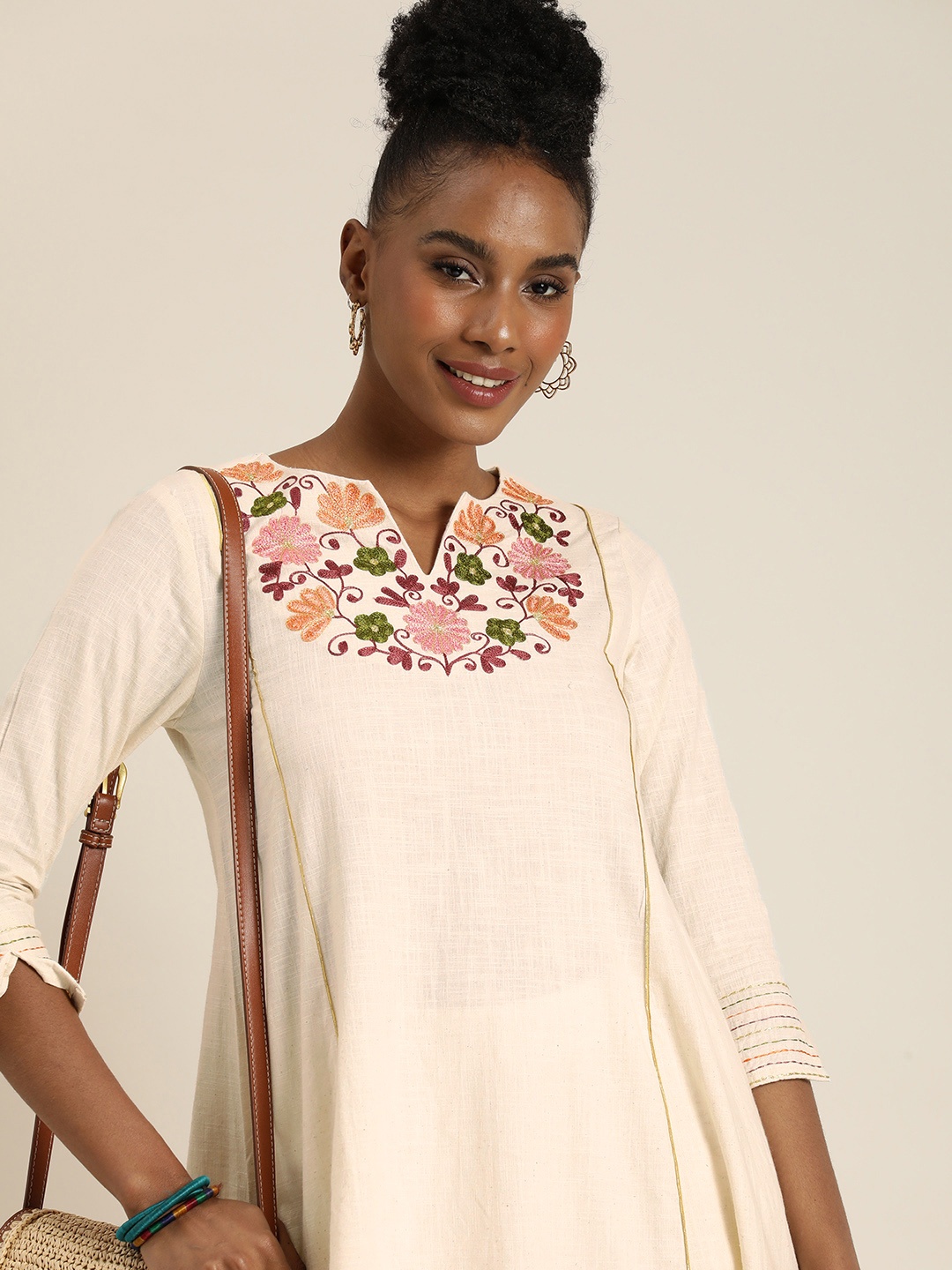 

Taavi Women Floral Embroidered Yoke Design Thread Work Pure Cotton A-Line Kurta, Off white