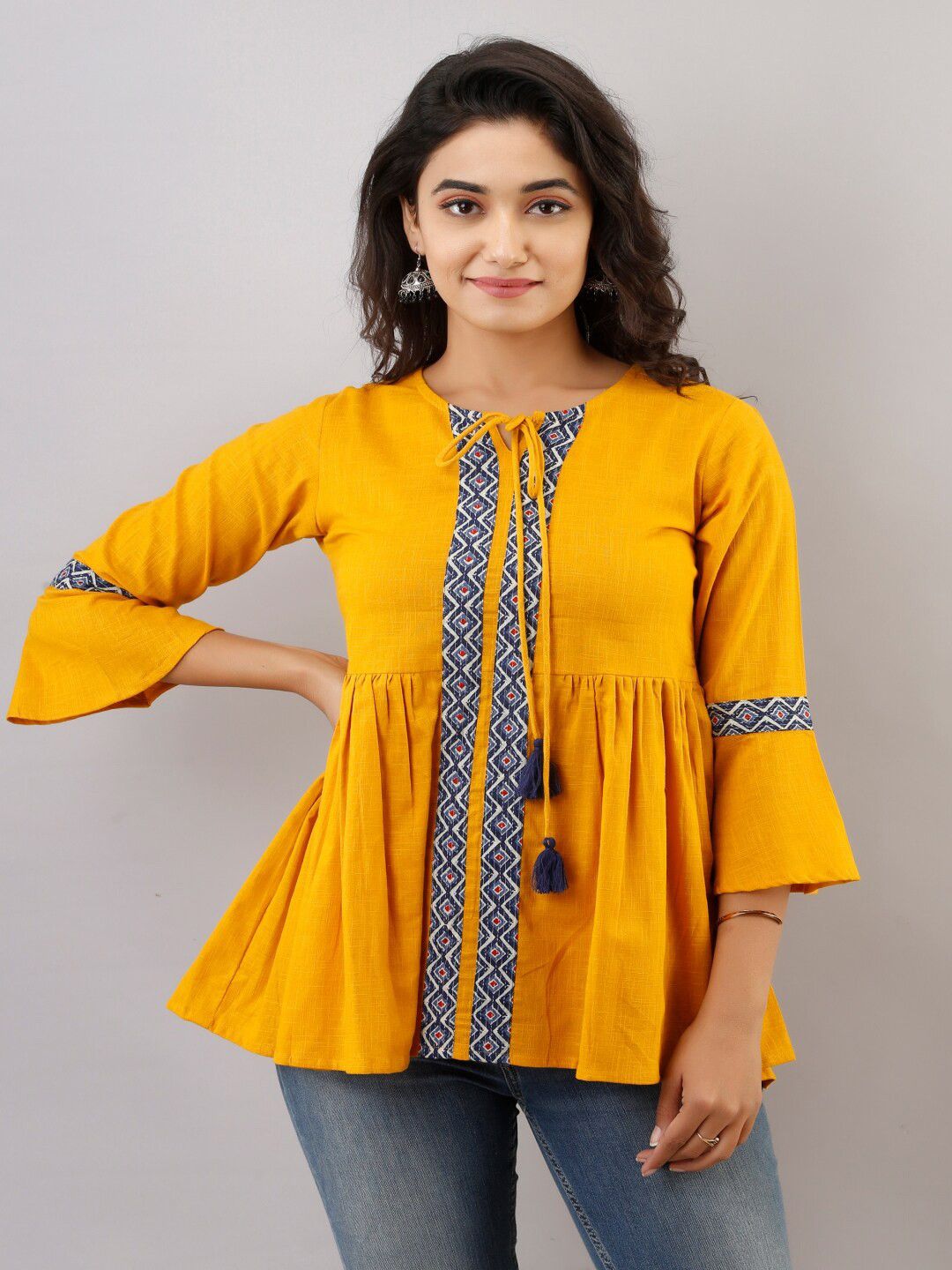 

KALINI Ethnic Printed Tie-Up Neck Bell Sleeves Pleated Cotton A-Line Top, Mustard