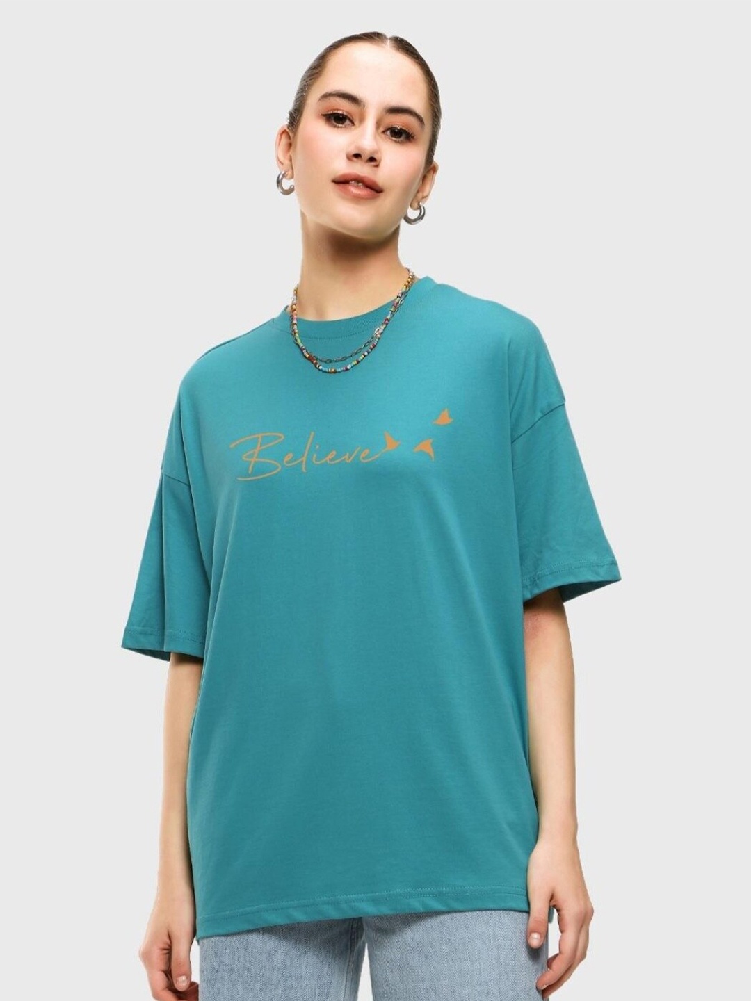 

Bewakoof Typography Printed Drop-Shoulder Sleeves Cotton Loose T-shirt, Turquoise blue