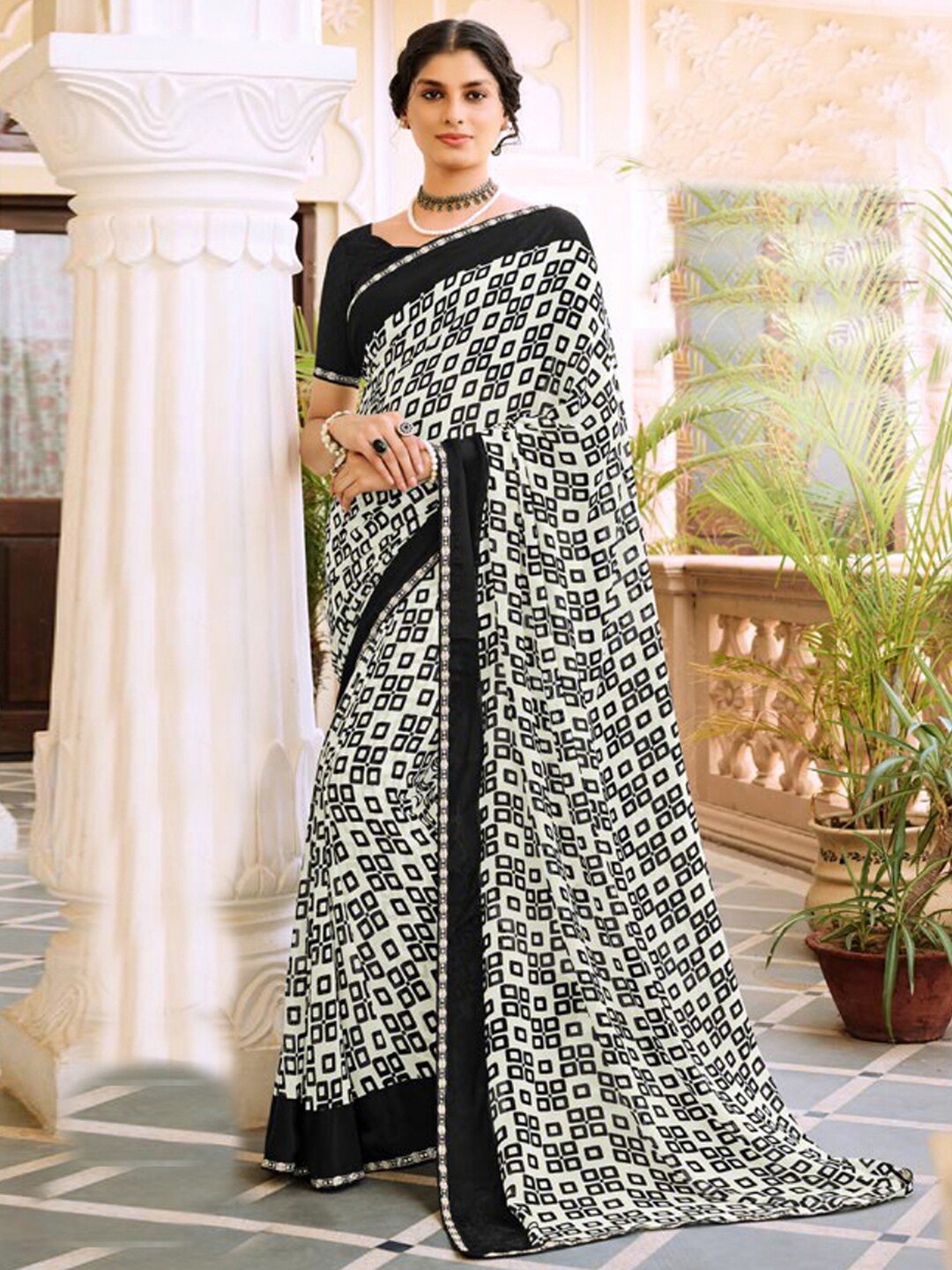 

Satrani Geometric Printed Embellished Border Saree, Black