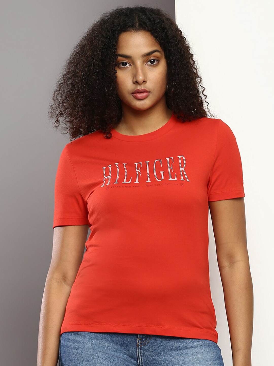 

Tommy Hilfiger Women Typography Printed Cotton Slim Fit T-shirt, Orange