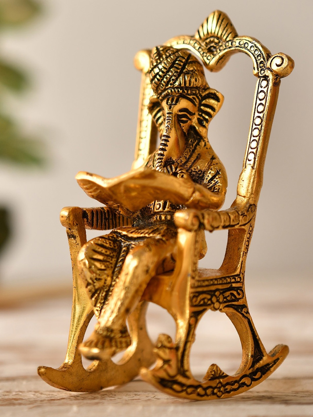 

Fashion Bizz Gold-Toned Kursi Ganesh Small Idol Showpiece