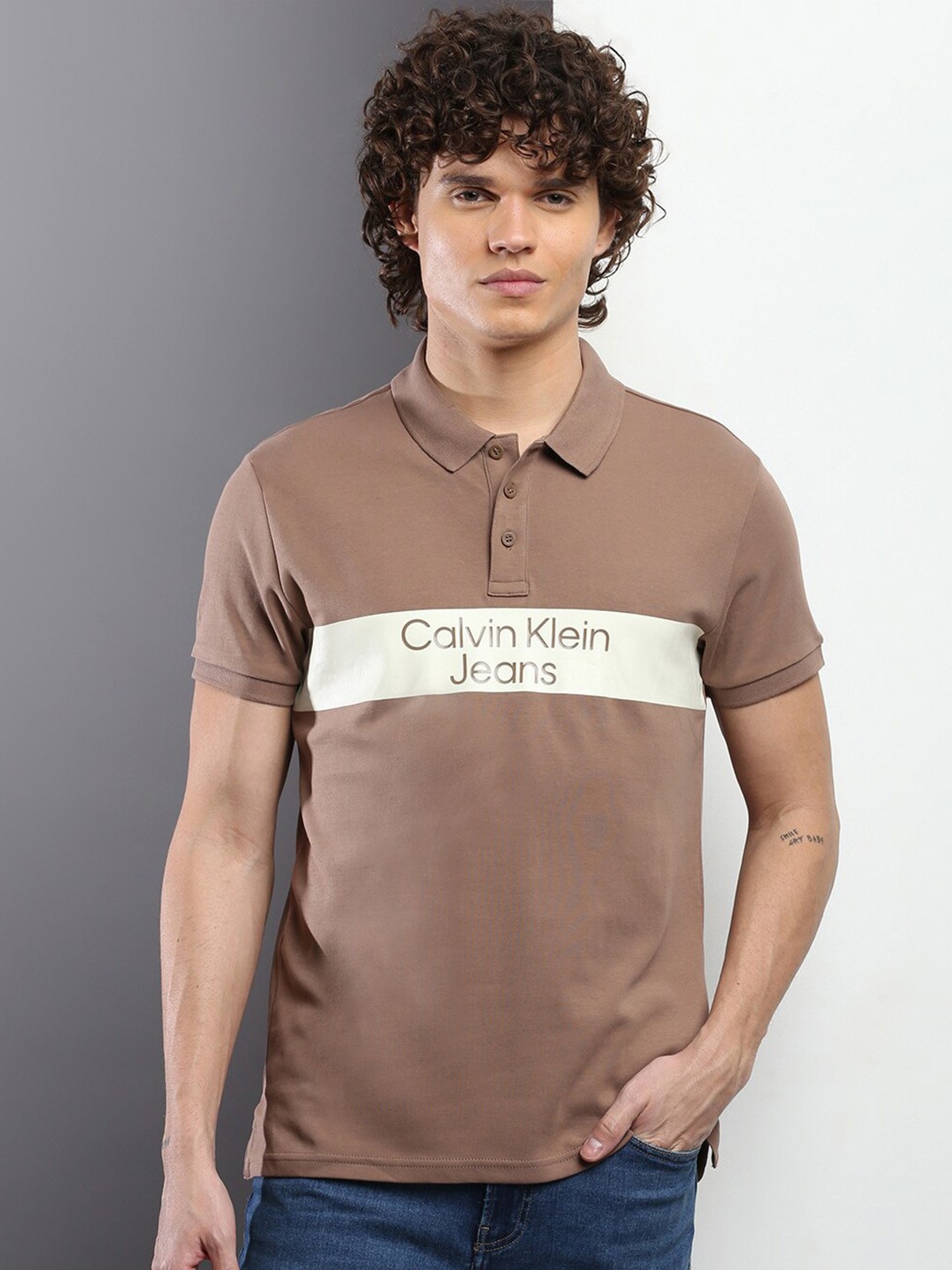 

Calvin Klein Jeans Typography Printed Short Sleeve Polo Collar Pure Cotton T-shirt, Brown