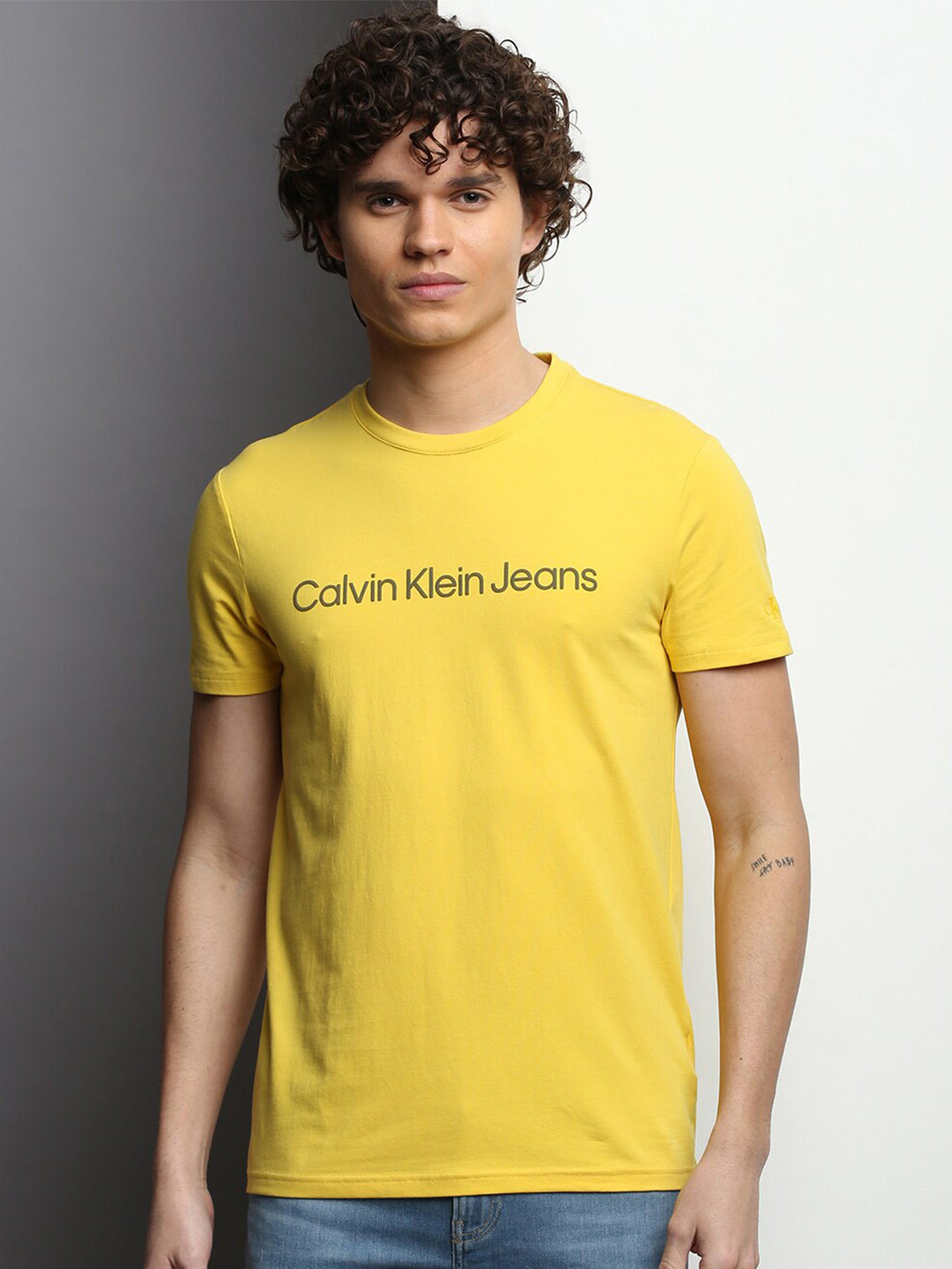 

Calvin Klein Jeans Typography Printed Round Neck Slim Fit Casual T-shirt, Yellow