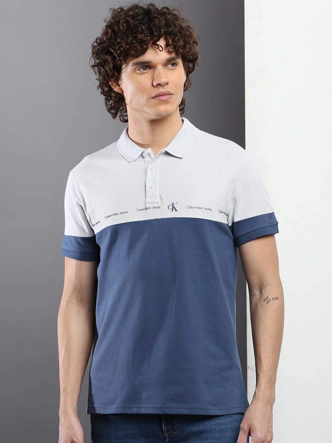 

Calvin Klein Jeans Colourblocked Typography Printed Polo Collar Slim Fit T-shirt, Blue