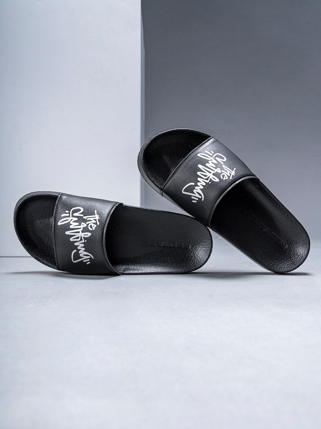 

Red Tape Men Black & Silver-Toned Printed Rubber Sliders