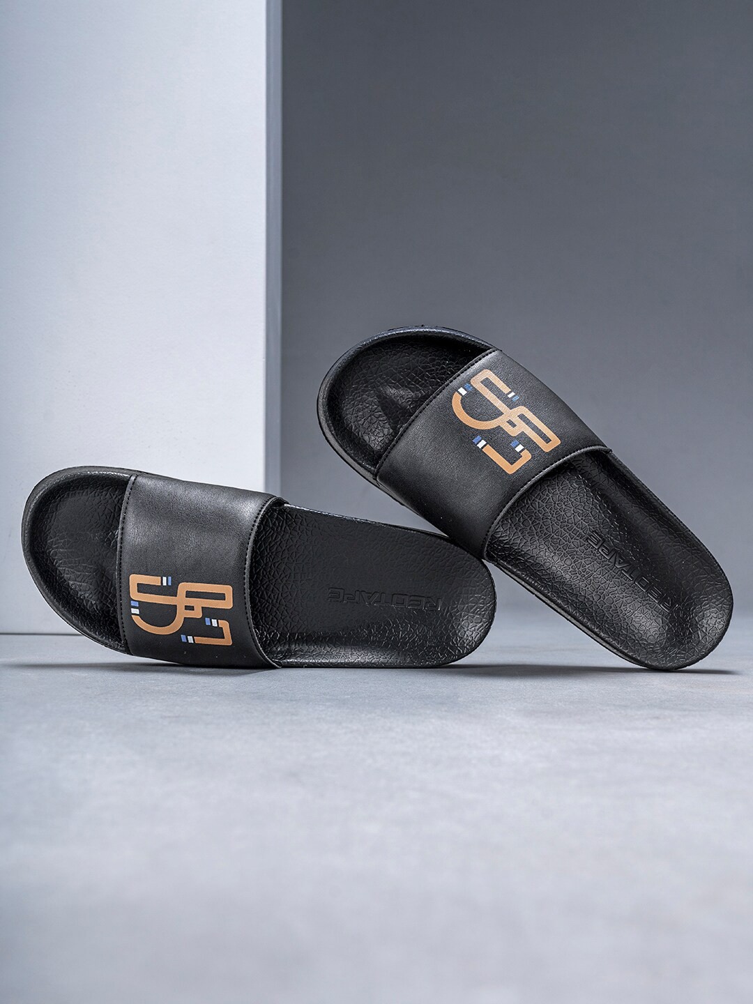 

Red Tape Men Printed Sliders, Black