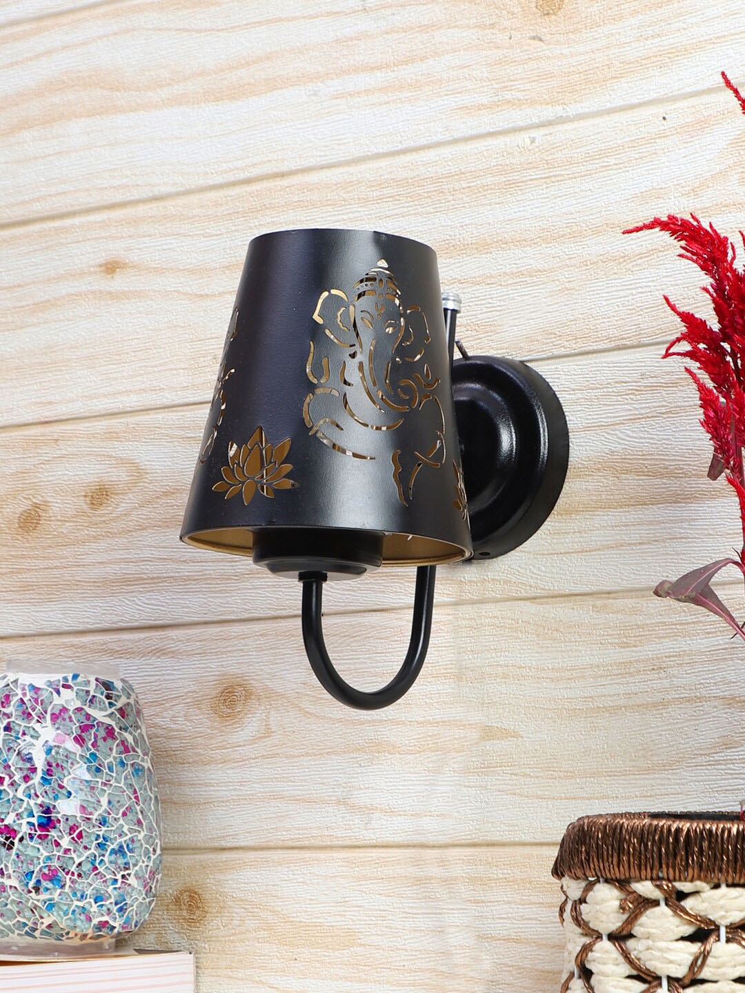 

Devansh Etched Black Textured Ganesh Ji Wall Mounted Lamp With Iron Base