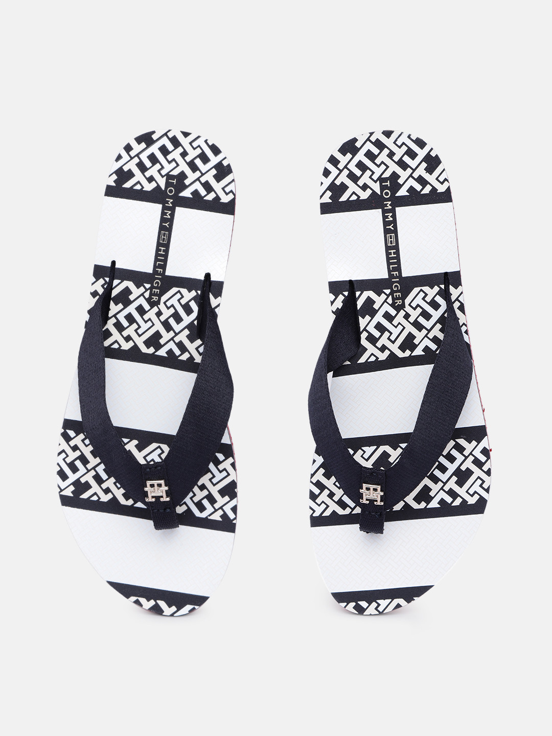 

Tommy Hilfiger Women Solid Thong Flip Flops With Brand Logo Print Footbed, Navy blue