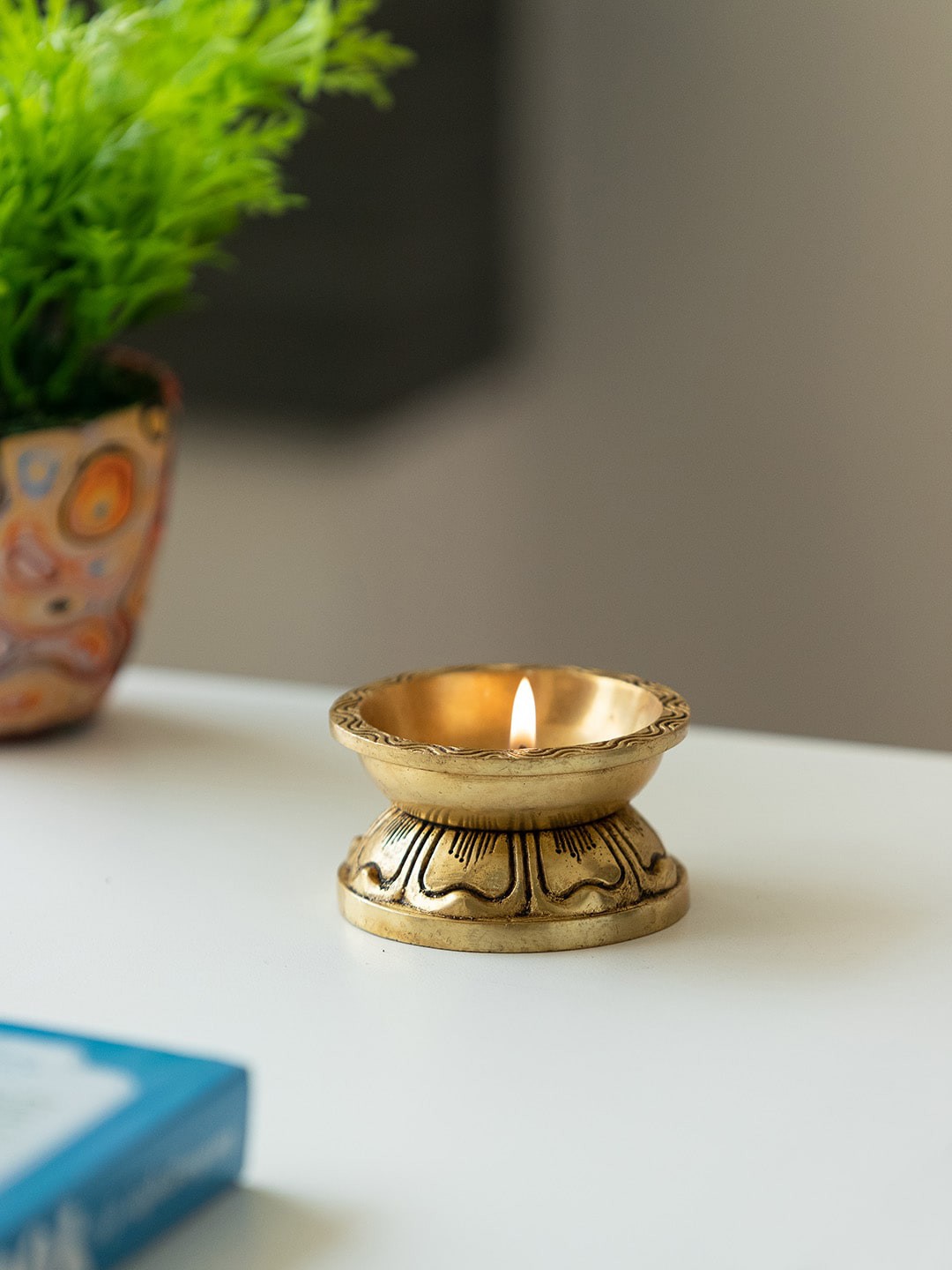

ExclusiveLane Gold-Toned Textured Brass Diya & Dhoop Dani